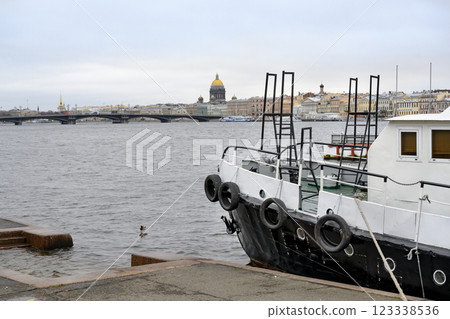 A fragment of a longboat moored on the Neva River in St. Petersburg, Russia, in autumn 123338536