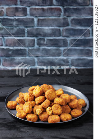crunchy breaded salmon fish nuggets on plate crunchy breaded salmon fish nuggets on plate 123338627