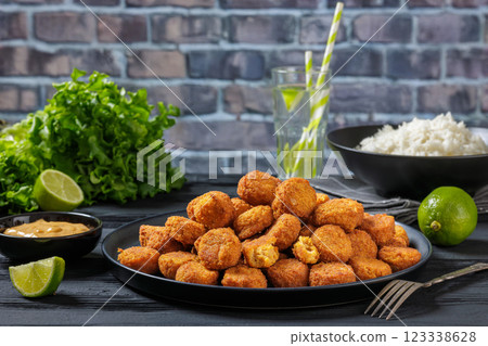crunchy breaded salmon fish nuggets on plate crunchy breaded salmon fish nuggets on plate 123338628