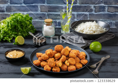 crunchy breaded salmon fish nuggets on plate crunchy breaded salmon fish nuggets on plate 123338629
