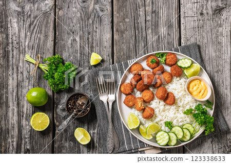 crunchy breaded salmon fish nuggets with rice crunchy breaded salmon fish nuggets with rice 123338633