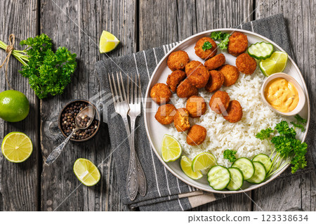 crunchy breaded salmon fish nuggets with rice crunchy breaded salmon fish nuggets with rice 123338634