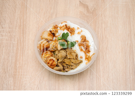 Bo Bun in plastic takeout container on wooden background. International cuisine 123339299