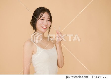 Female with mouthpiece correction Female with mouthpiece correction 123341779