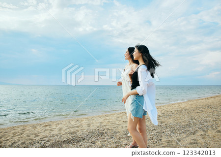 Woman looking at the summer sea 123342013
