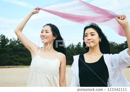 Woman looking at the summer sea Woman looking at the summer sea 123342111