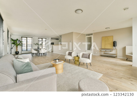 Spacious living room featuring minimalist furniture, natural light, and a contemporary color palette, perfect for relaxation and social gatherings. Spacious living room featuring minimalist furniture, natural light, and a contemporary color palette, perfect for relaxation and social gatherings. 123342130