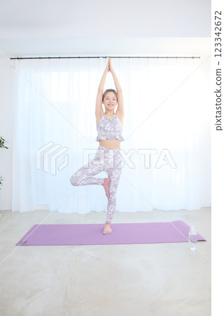 Woman doing yoga and pilates 123342672