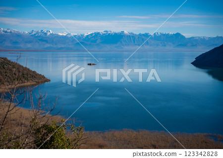 View of Skadar Lake with reeds on mountains background in winter, Montenegro 123342828