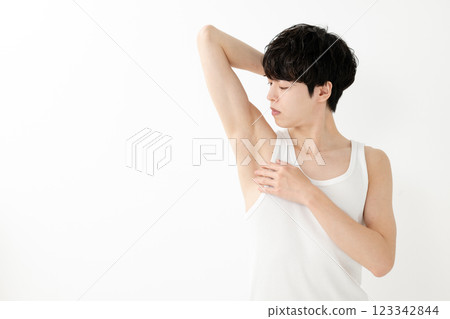 Smiling man, armpit hair removal, beauty 123342844