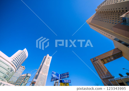 Yokohama cityscape in Japan, in front of Sakuragicho Station. View of Yokohama Landmark Tower, Cross Gate, signs, etc. 123343995