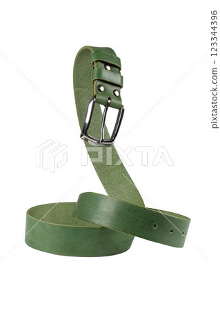 The green leather belt with a metal buckle is beautifully curved and isolated on a white background. 123344396