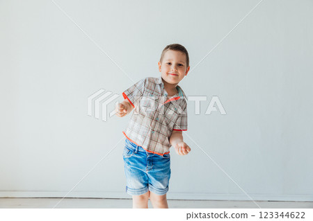 Little boy 6 years old smiling on white background 123344622