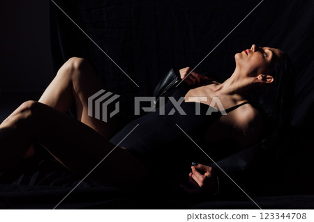 Beautiful slim fashion brunette woman in leather jacket Beautiful slim fashion brunette woman in leather jacket 123344708