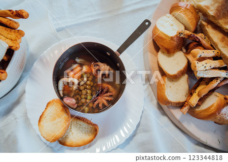 Soup from sea products and bread bakery products 123344818