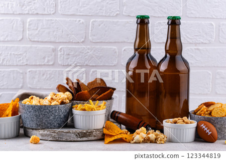 Beer and different snacks for Superbowl or football party 123344819