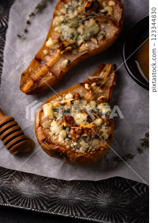 Baked pears with blue cheese and honey 123344830