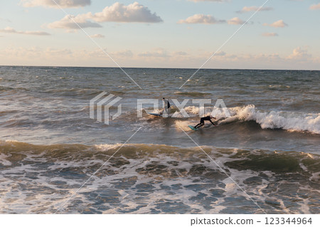 Men surfing the waves summer 123344964