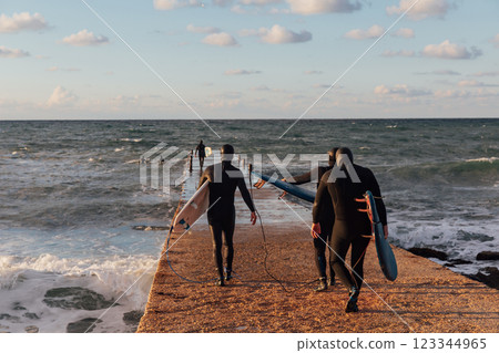 Men surfing the waves summer 123344965