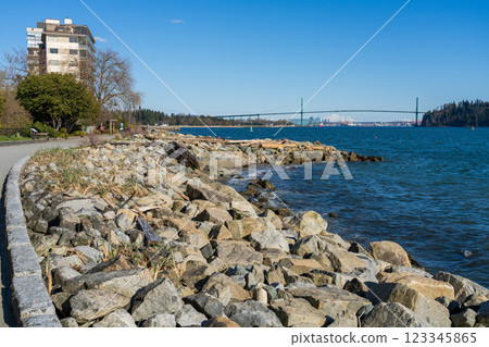 West Vancouver, BC, Canada - April 12 2021 : Centennial Seawalk in a beautiful sunny day. West Vancouver, BC, Canada - April 12 2021 : Centennial Seawalk in a beautiful sunny day. 123345865
