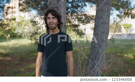 Young Long Hair Man Marveled In Nature Near A Tree Young Long Hair Man Marveled In Nature Near A Tree 123346008