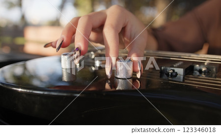 Woman Hands Turn Knobs For Tone Of Electric Bass Musical Instrument Woman Hands Turn Knobs For Tone Of Electric Bass Musical Instrument 123346018