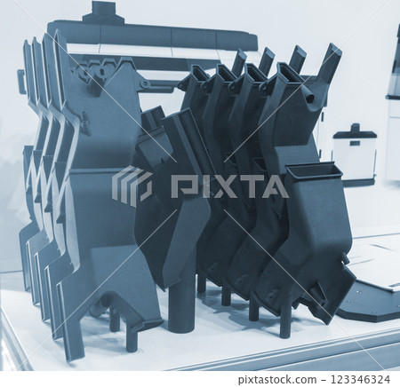 Complex multi-part model printed on 3D printer from black polyamide powder. Detailed prototype created on 3D printer from plastic powder. 3D printing powder technology. Multi Jet Fusion MJF technology 123346324