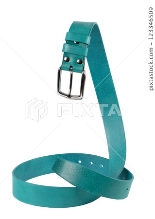 The green leather belt with a metal buckle is beautifully curved and isolated on a white background. The green leather belt with a metal buckle is beautifully curved and isolated on a white background. 123346509