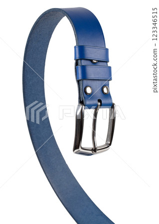 The blue leather belt with a metal buckle is beautifully curved and isolated on a white background. The blue leather belt with a metal buckle is beautifully curved and isolated on a white background. 123346515