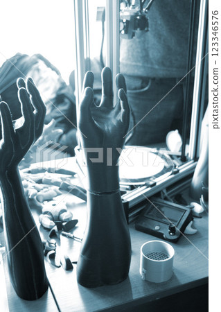 Three-dimensional object printed on 3D printer. Abstract interior model human hand with fingers created on 3d printer. Concept FDM 3D Printing technologies. Additive modern new progressive technology 123346576