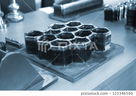 Object printed by 3D printer from metal. Additive manufacturing solution. Object created on 3Dprinter from melting metal thread. 3D Metal Printing. Metal additive manufacturing 123346580