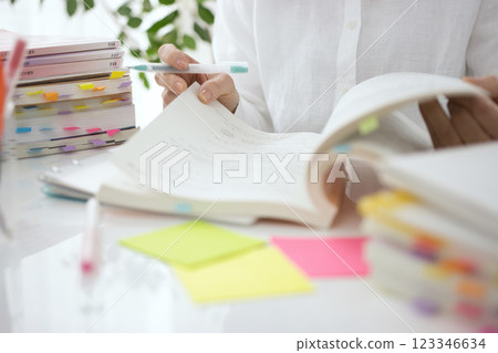 The hands of a middle-aged woman studying The hands of a middle-aged woman studying 123346634