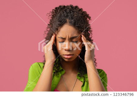 Pretty woman is suffered headache. Migraine, holds temples, magnetic storms 123346796