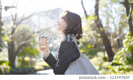Young business woman walking in a suit 123347697