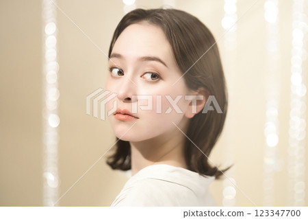 Beauty image of a young woman with medium-long hair Beauty image of a young woman with medium-long hair 123347700