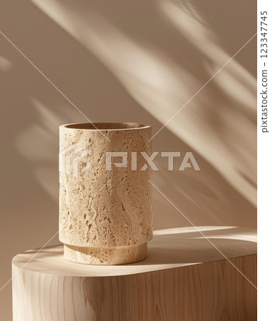 Stone Vase on Wooden Surface with Soft Light and Shadows 123347745