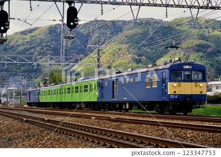 2006: Kumoya 145 sandwich 103 series train running on the Tokaido Line 2006: Kumoya 145 sandwich 103 series train running on the Tokaido Line 123347753