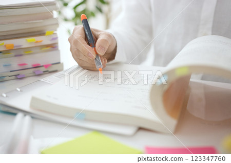 The hands of a middle-aged woman studying The hands of a middle-aged woman studying 123347760