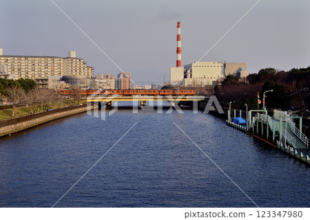 2006: Osaka Loop Line train crossing the river 123347980