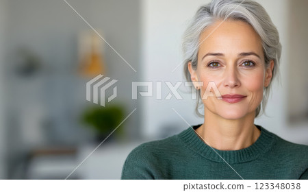 Smiling mature female doctor in front of office in care clinic and development of wellness and fitness lifestyle for seniors, copy space for rehabilitation therapy concept 123348038
