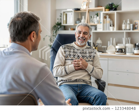 dialogue of two medical colleagues in the break room of a rehabilitation center and chatting and discussing common interests during a coffee break 123348048