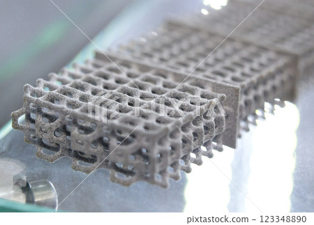 Multi-part model printed on 3D printer from grey polyamide powder. Detailed prototype created on 3D printer from plastic powder. 3D printing powder technology Multi Jet Fusion MJF technology Multi-part model printed on 3D printer from grey polyamide powder. Detailed prototype created on 3D printer from plastic powder. 3D printing powder technology Multi Jet Fusion MJF technology 123348890