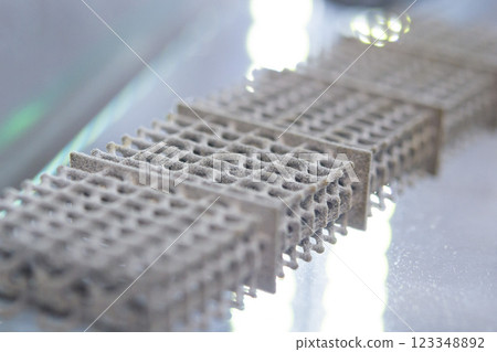 Object printed on a 3D printer from molten plastic powder. Different model printed on 3D printer from melted black polyamide powder. New additive 3D printing Multi Jet Fusion MJF technology 123348892