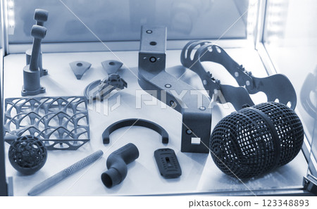 Complex multi-part models printed on 3D printer from grey polyamide powder. Detailed prototype created on 3D printer from plastic powder. 3D printing powder technology. Multi Jet Fusion MJF technology 123348893