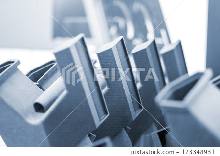 Complex multi-part model printed on 3D printer from black polyamide powder. Detailed prototype created on 3D printer from plastic close-up. 3D printing technology. Multi Jet Fusion MJF technology 123348931