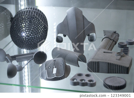 Models printed on 3D printer from grey polyamide powder close-up. Detailed prototype created on 3D printer from plastic powder. 3D printing additive powder technology, Multi Jet Fusion MJF technology 123349001