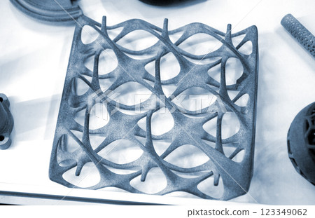 Model printed on 3D printer from grey polyamide powder close-up. Detailed prototype created on 3D printer from plastic powder. 3D printing additive powder technology, Multi Jet Fusion MJF technology 123349062