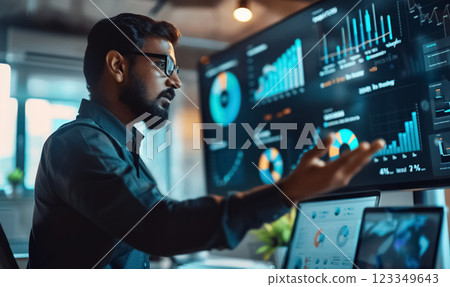 Professional speaker giving business presentation with graphs and charts, discussing data analysis in corporate environment 123349643