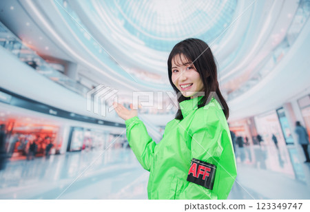 Event staff guiding customers at a shopping mall 123349747