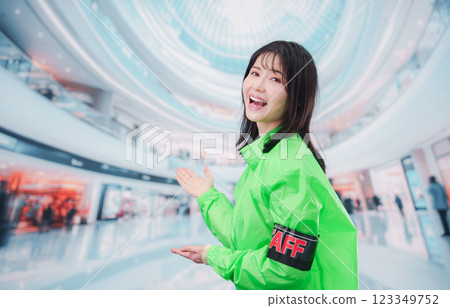 Event staff guiding customers at a shopping mall 123349752